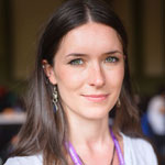 Profile of a woman smiling with long brown hair