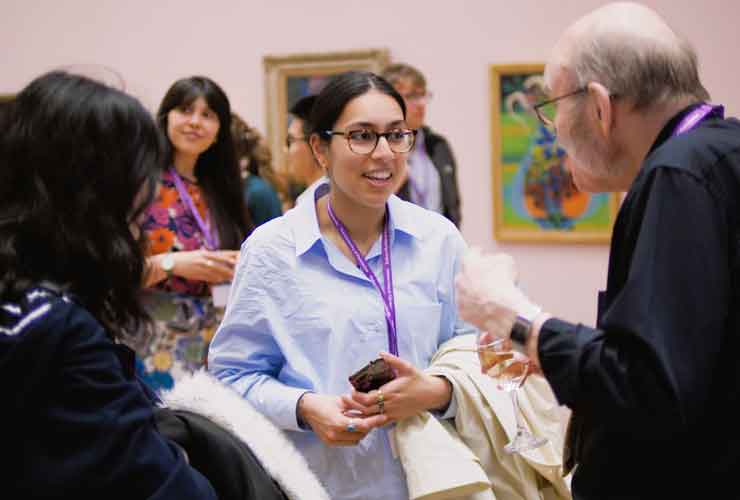 Aneeqa talking to a gentlemen at a networking event