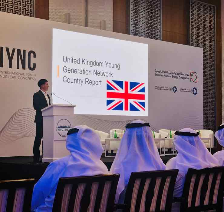 Jordan stood on stage presenting at the International Youth Nuclear Congress and talking about the UK Young Generation Network Country Report