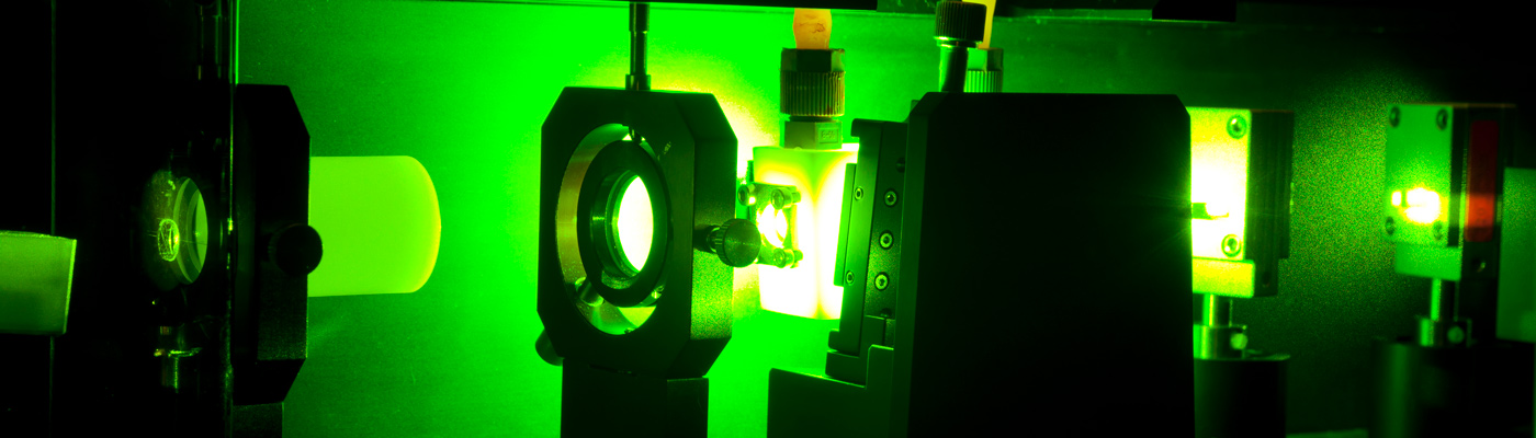 Machinery in dark room emitting green light